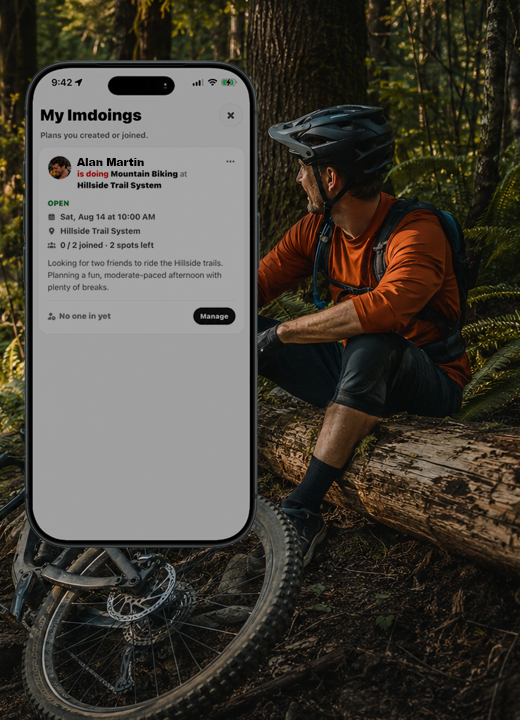 Sitting with a mountain bike in the woods